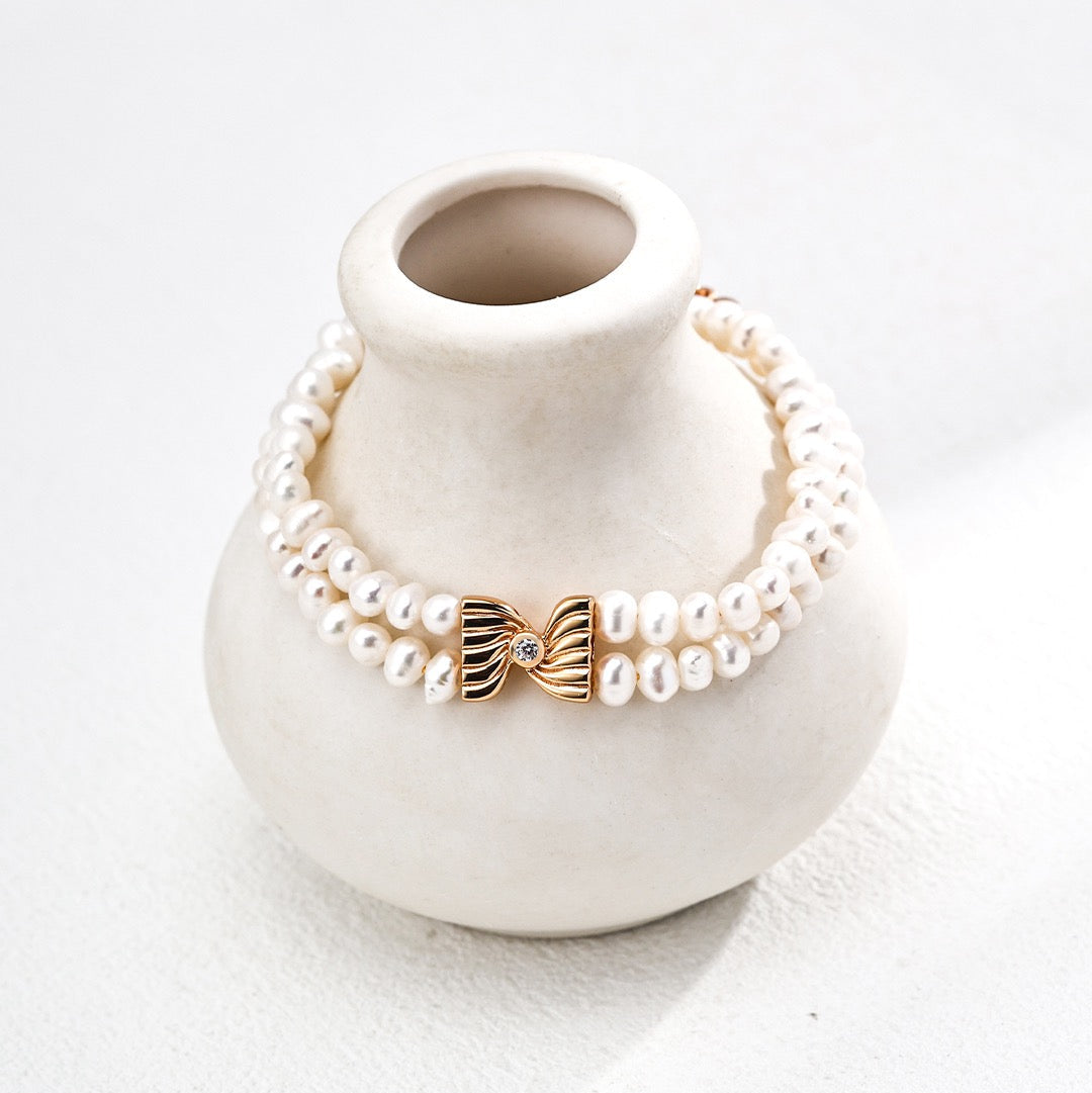 Double Pearl Strand Silver Bracelet with Sculpted Bow Centre