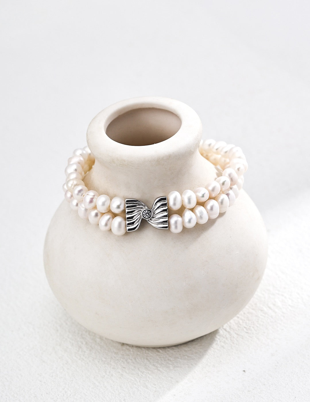 Double Pearl Strand Silver Bracelet with Sculpted Bow Centre