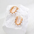 Pearl Hoop Silver Earrings with Sculpted Frame Design