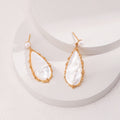 Shell Pearl Silver Drop Earrings with Organic Teardrop Design
